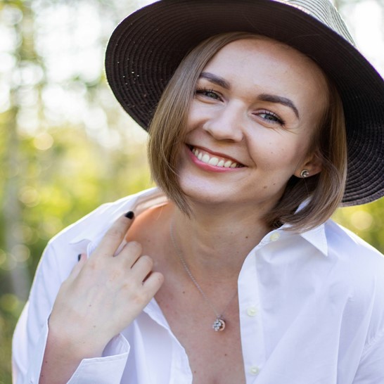 Woman smiling after dental implant healing time recovery period